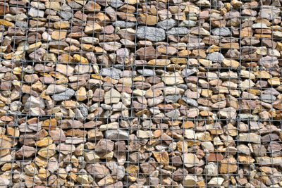 With different colored stones your fence will look interesting.