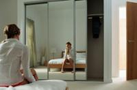 Attach mirror film to the wall
