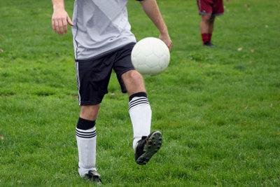 When playing football, the knees are put under intense strain. 