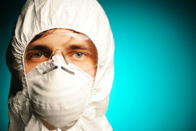 Wear respiratory protection and protective suit when tackling the mold on the wall.