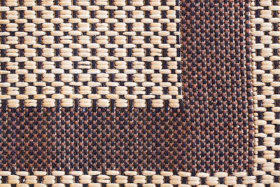 Dried water stains on the sisal carpet are difficult to remove.